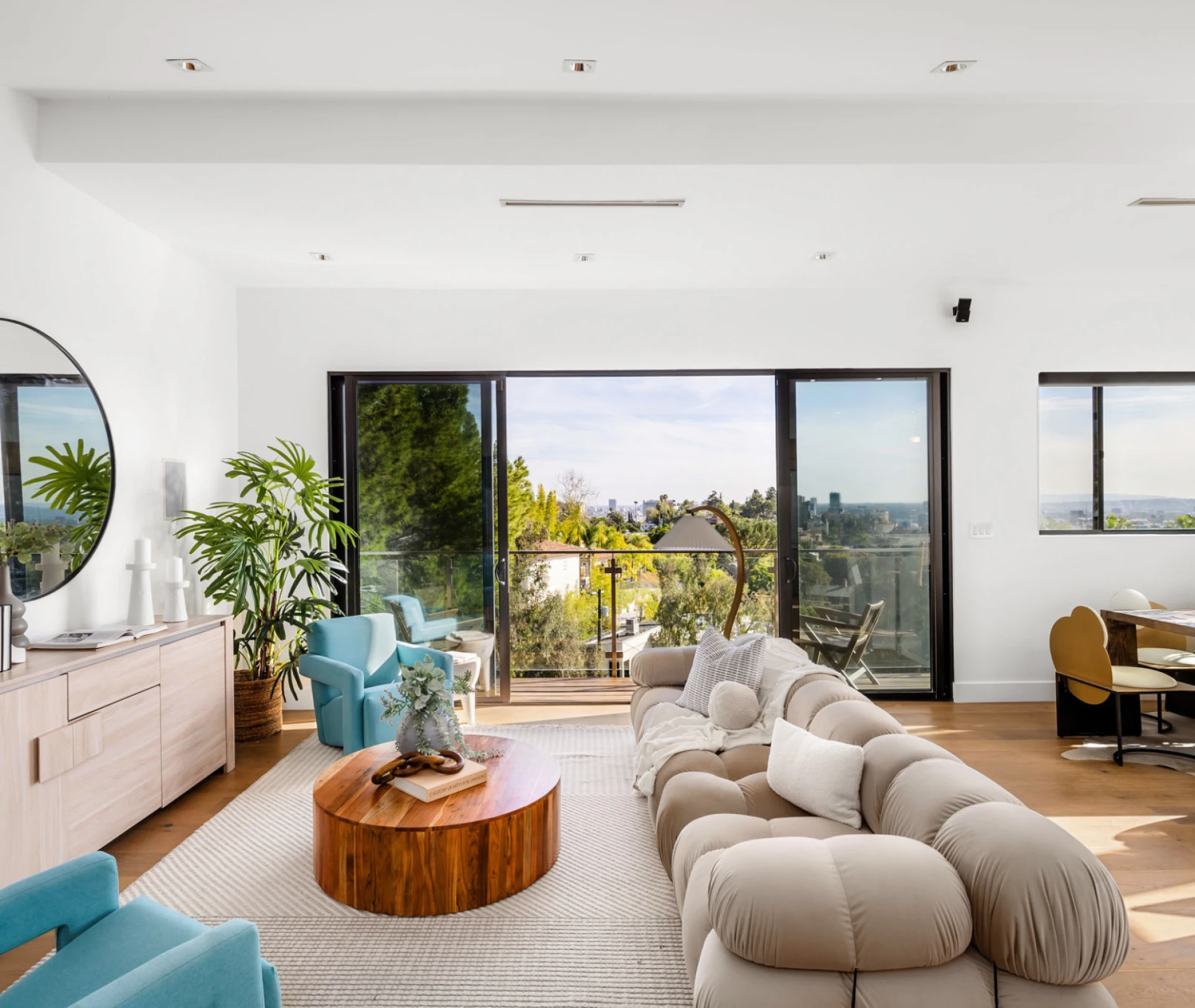 Modern living room with large glass doors.
